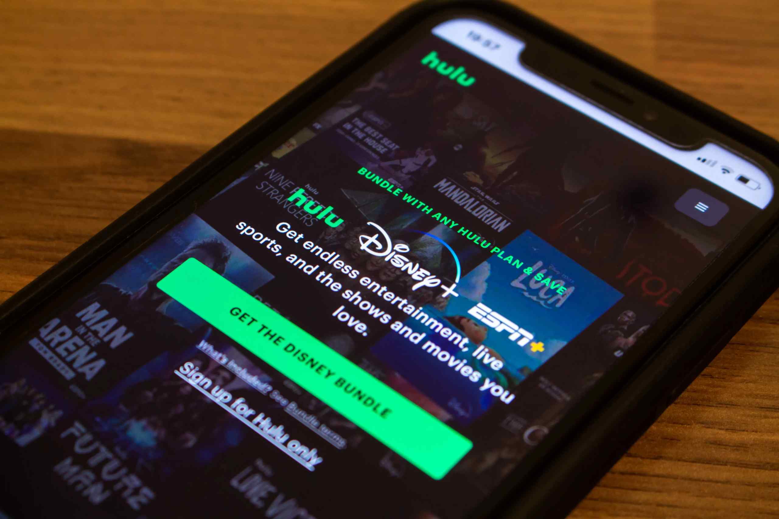 A smartphone showing an add for the Hulu/Disney/ESPN bundle.